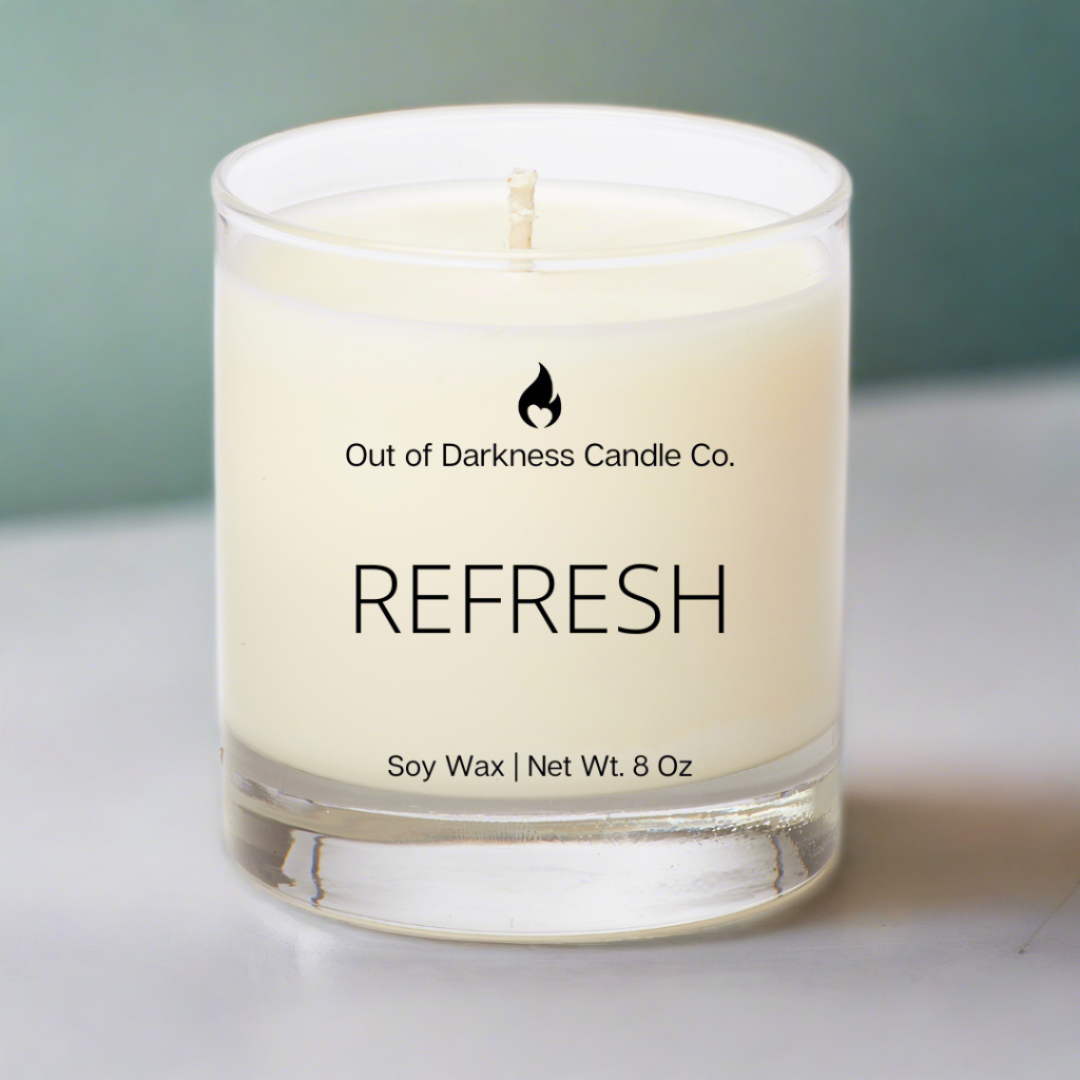 glass jar candle says refresh all white background