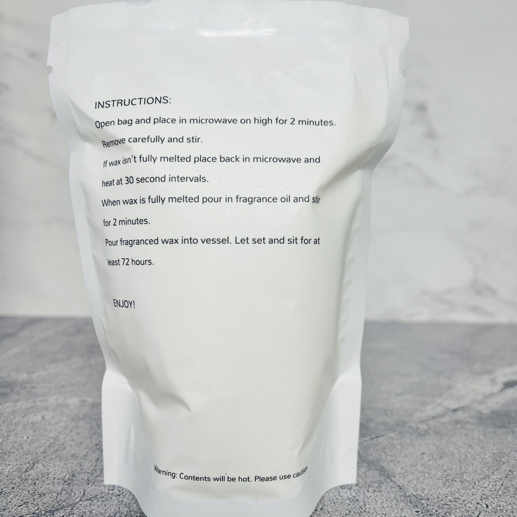 A stand up bag that says instructions for refilling a candle vessel