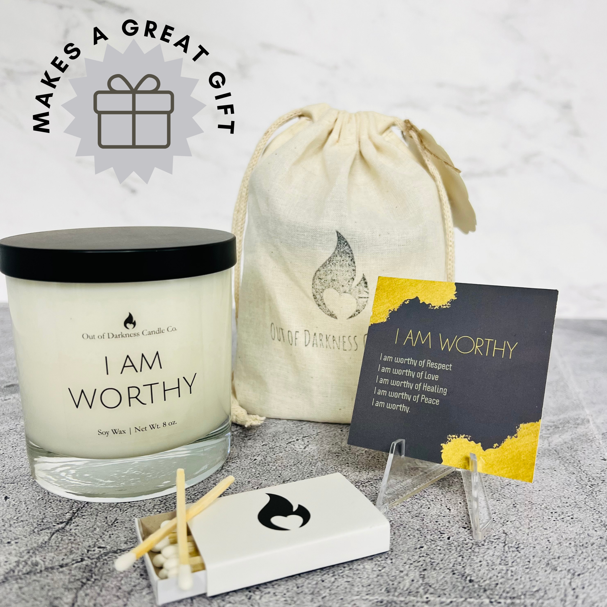 clear glass jar candle says I am worthy a muslin pouch an I am worthy affirmation card and a book of matches, says makes a great gift